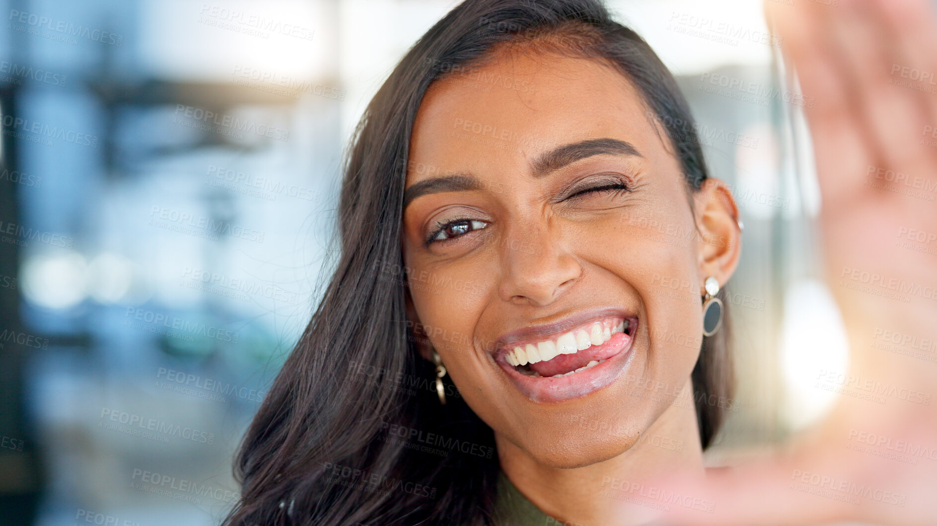 Buy stock photo Selfie, wink and tongue with a business indian woman in her office for a profile picture, comedy or humor. Portrait, smile and funny face for social media with a happy young employee in the workplace