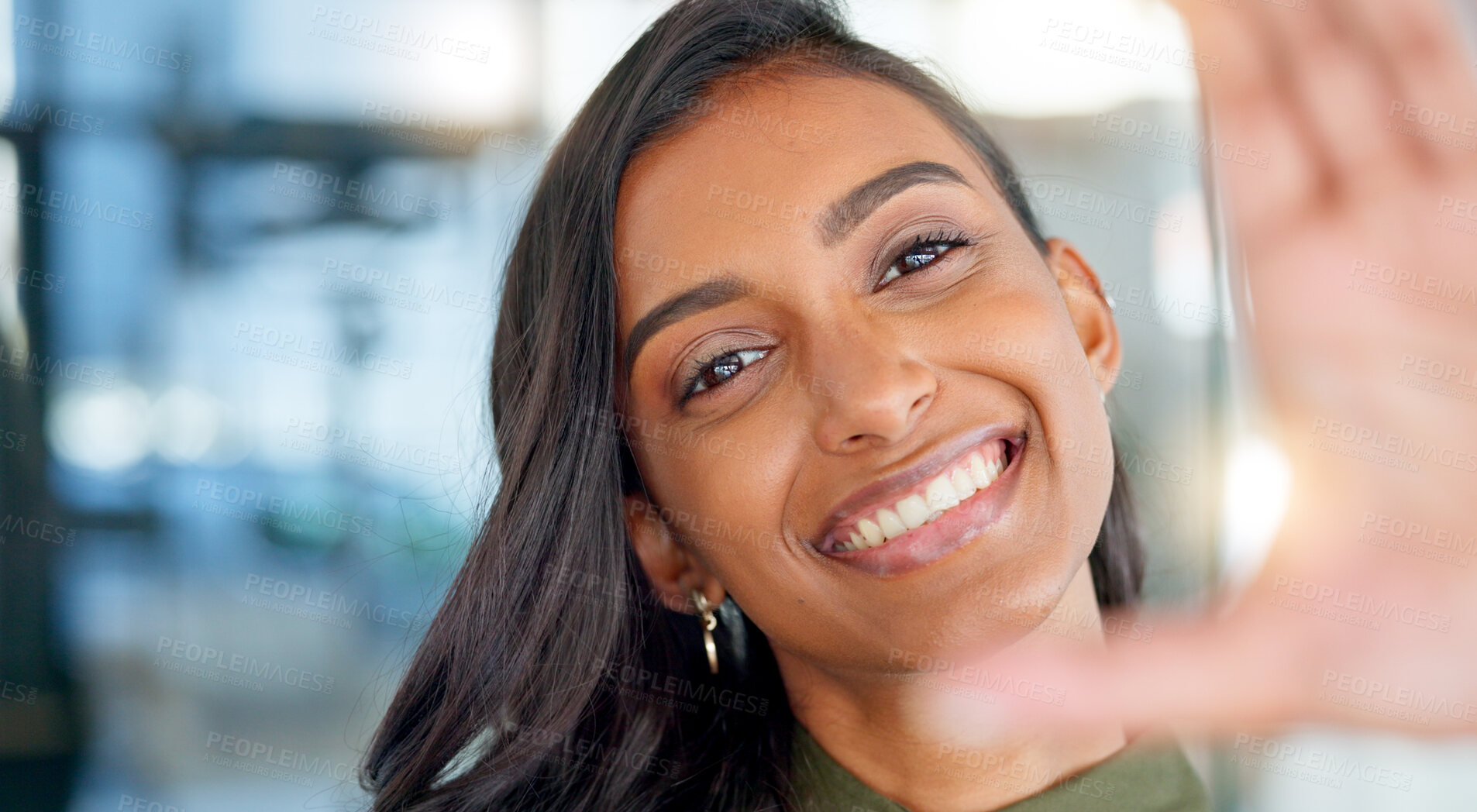 Buy stock photo Selfie, frame and happy with a business indian woman in her office for a social media profile picture. Portrait, smile and confident with a young employee taking a closeup photograph in the workplace