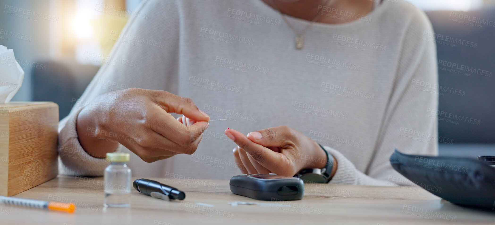 Buy stock photo Hands, blood sugar test and machine at table, preparation and injection for healthcare, sample and check glucose. Medical tech, needle and monitor for diabetes, wellness and pharma product in house