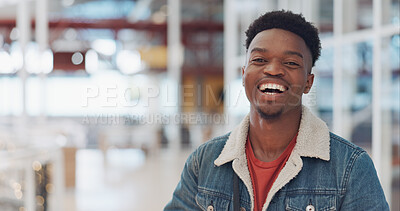 Black man, face and smile portrait in building for designer success, positive mindset and employee standing in lobby. African man, portrait and happy for innovation vision or entrepreneur headshot