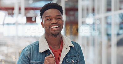 Black man, face and smile portrait in building for designer success, positive mindset and employee standing in lobby. African man, portrait and happy for innovation vision or entrepreneur headshot