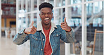 Thumbs up, black man and celebrate success in trendy startup, marketing agency and motivation for winning, goals and agreement. Happy worker, hipster and guy thumb up in support, trust and hand emoji