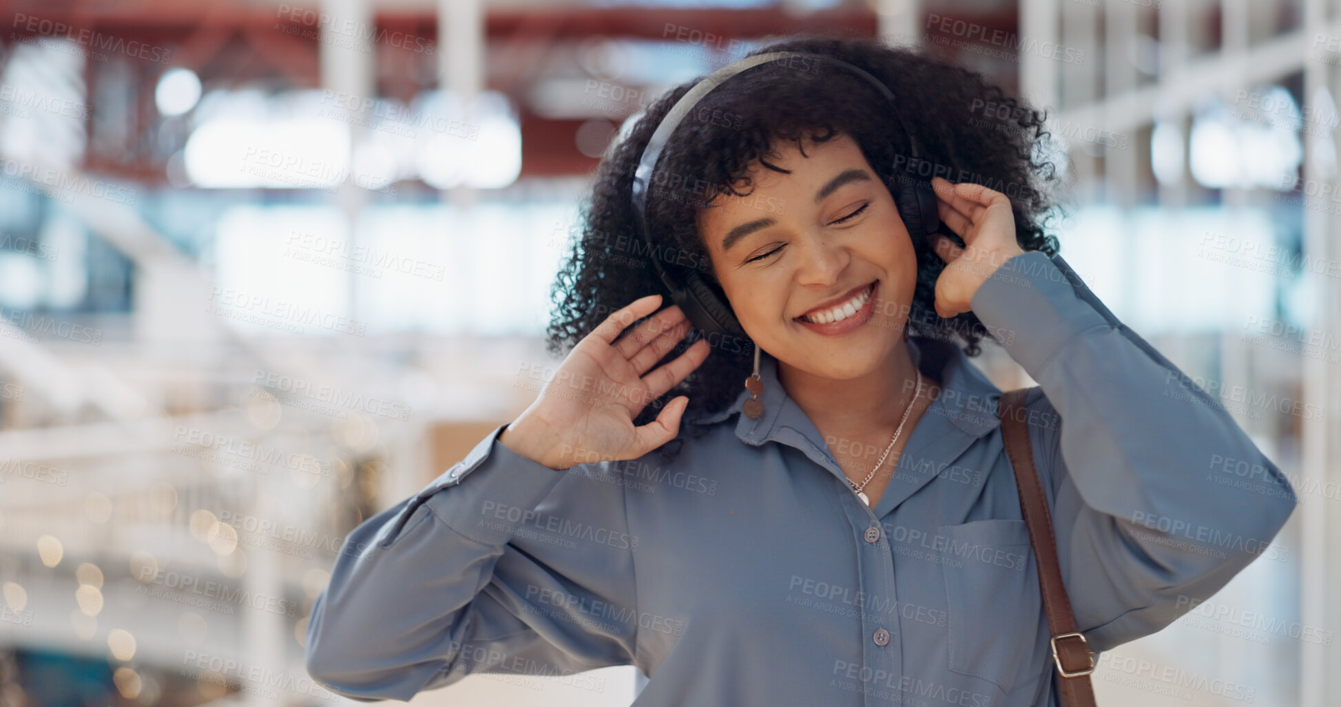 Buy stock photo Walking, dance or happy woman in office with headphones for an online playlist or audio in startup building. Wellness, travel or excited person streaming radio music, podcast or calm sound with smile