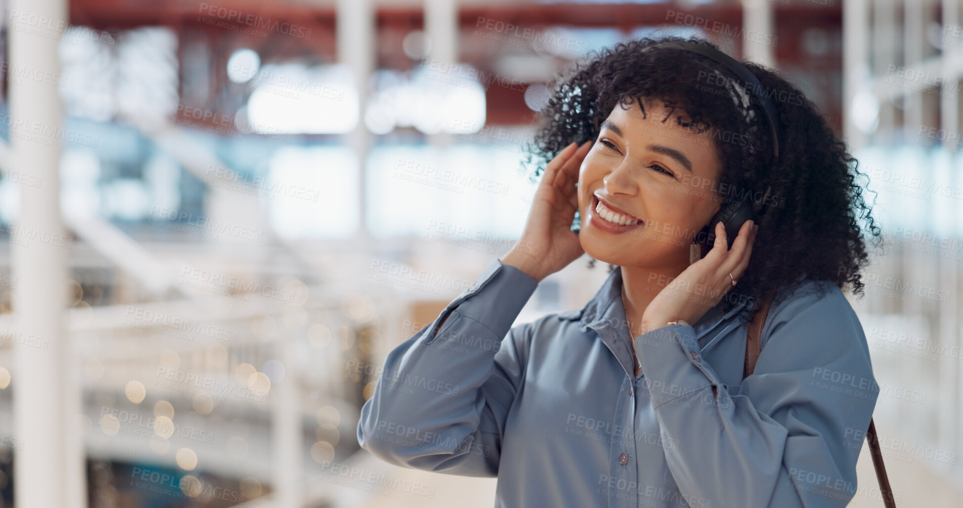 Buy stock photo Smile, thinking or happy woman in office with headphones for an online playlist or audio in startup building. Walking, travel or person streaming radio music, podcast or calm sound to relax on break