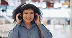 Music, headphones and black woman in mall for freedom, relax and calm energy, dance, listening and happy with her travel journey. Urban building, gen z and audio technology for inspiration in retail