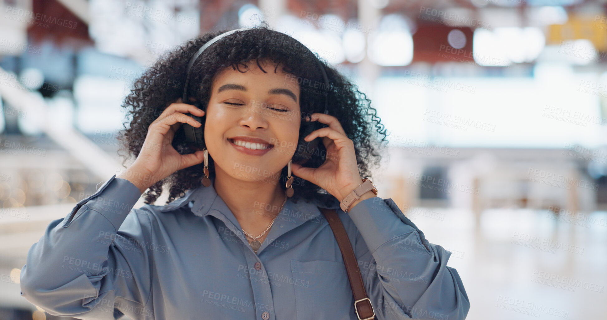 Buy stock photo Walking, listening or happy woman in office with headphones for an online playlist or audio in startup. Wellness, travel or person streaming radio music, podcast or calm sound with smile to relax