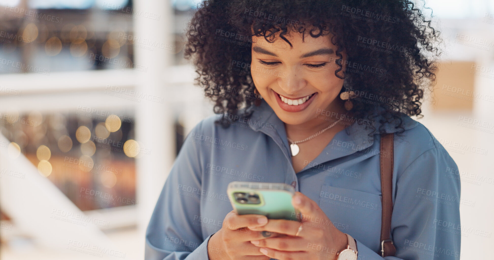 Buy stock photo Phone, typing and black woman in shopping mall on social media, texting and internet browsing. Technology, cellphone and happy female with mobile smartphone laughing at comic joke, meme or comedy.