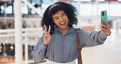 Black woman influencer, selfie and peace sign with smile, smartphone or walking in urban shopping mall. Happy, phone and woman with hand gesture for social media, web or online app at mall in Atlanta