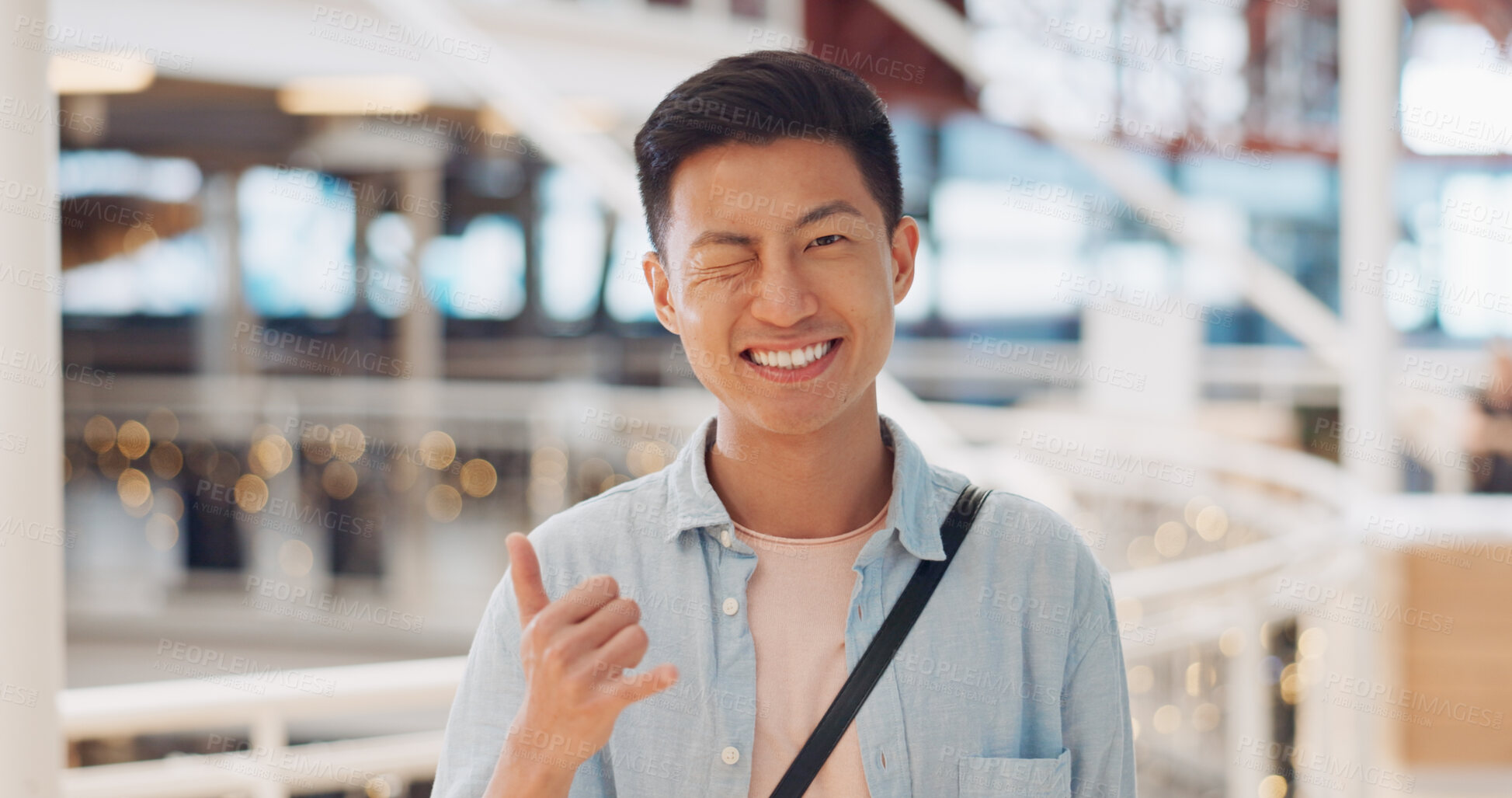 Buy stock photo Man, wink and smile in portrait of employee in startup with marketing designer in Korea modern office or workplace. Cool, businessman or hand gesture for success in career at advertising agency