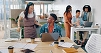 Teamwork, laptop and business people fist bump in office for  success celebration. Training, coaching and Asian woman teaching black man, support and advice while celebrating after solving problem.