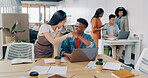 Teamwork, laptop and business people fist bump in office for  success celebration. Training, coaching and Asian woman teaching black man, support and advice while celebrating after solving problem.