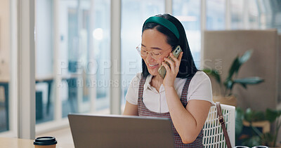 Phone call, communication and business woman writing notes in office. Laptop, cellphone and Asian woman at desk on mobile smartphone chatting, speaking or business deal conversation with contact.