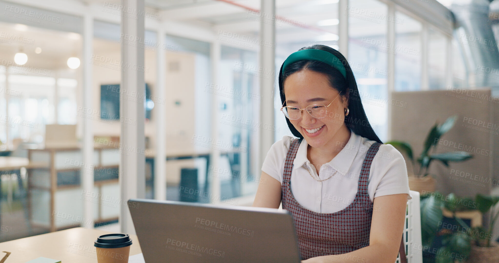 Buy stock photo Asian woman in office, happy and reading on laptop for market research, email or online report at startup. Businesswoman at desk with computer, web search and typing article at Japanese tech agency.