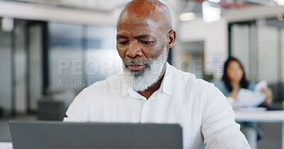 Laptop, office and african businessman with company financial research, kpi review and online report in focus, mission and goals. Senior corporate employee working on pc technology at desk workspace