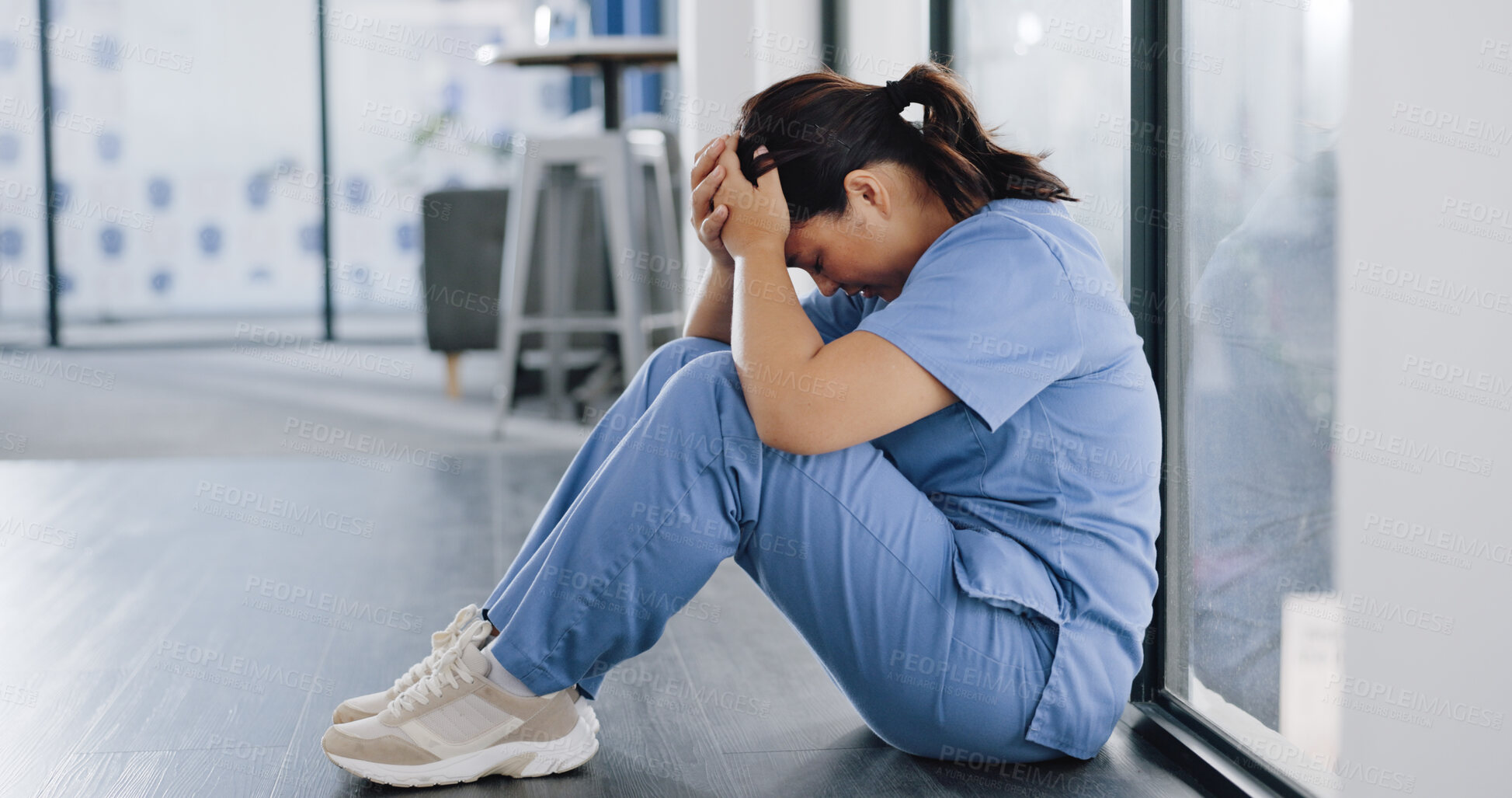 Buy stock photo Stress, woman or tired doctor in hospital hallway with burnout, problem and mental health crisis in clinic. Frustrated, fatigue and anxiety in healthcare service, sad medical nurse on floor in clinic