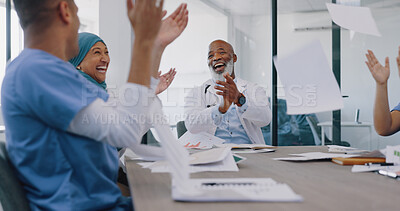 Doctors, applause and high five with success and paper confetti, celebrate win in health and cheers for team building. Happy, medical innovation win and target goal with motivation and diversity.