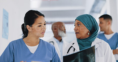 Buy stock photo Muslim, doctor or nurse in meeting with xray for advice and help in healthcare discussion for lungs or MRI. Medical talk, mature woman or team in collaboration for surgery with a surgeon in hospital