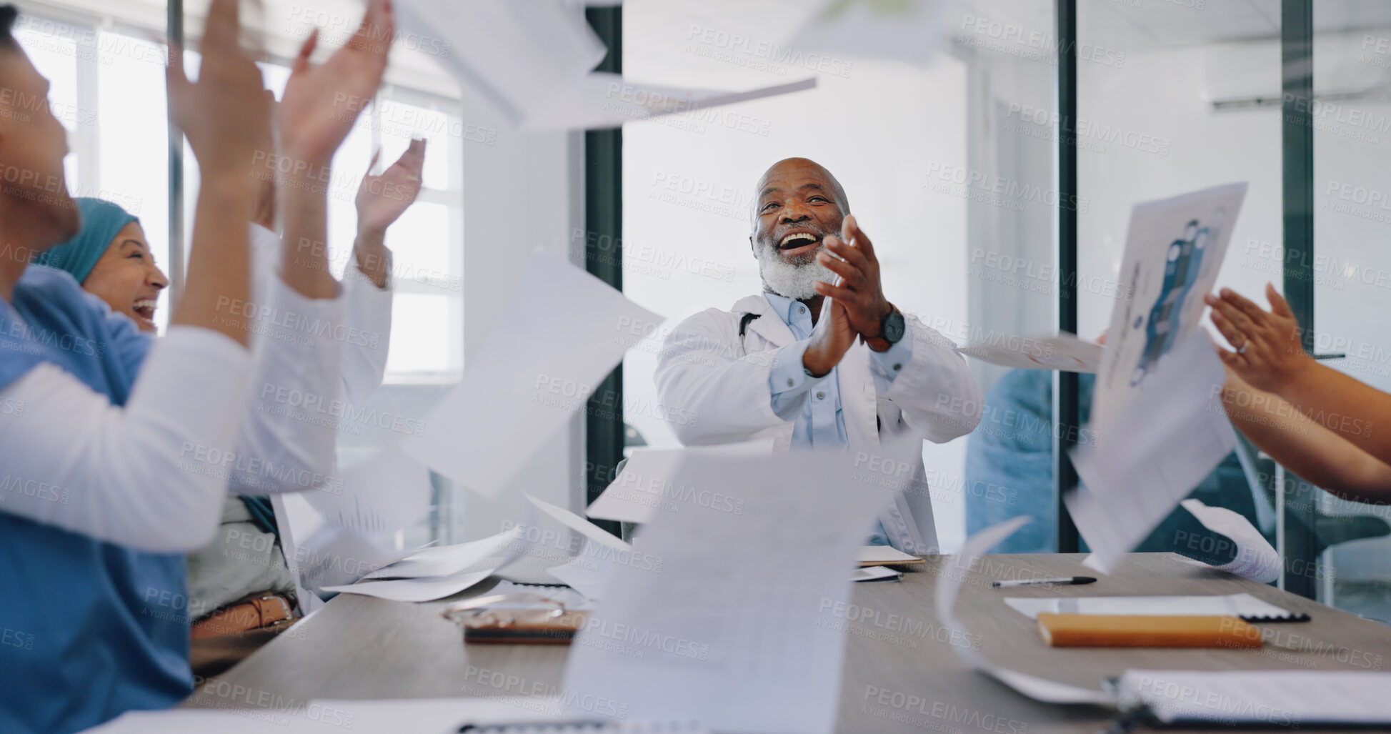Buy stock photo Doctors, team and throw paper for celebration, winning and success with teamwork, support and diversity. Men, women and applause for confetti, goals and medical results with smile in clinic office