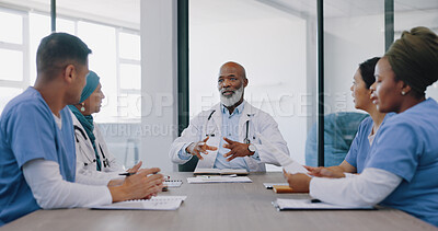 Mature doctors, nurses or teamwork meeting in hospital planning, medical surgery ideas or medicine treatment strategy. Talking healthcare workers, men or women with paper documents in collaboration