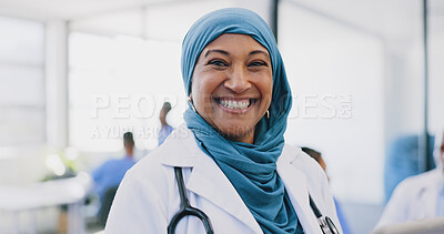 Buy stock photo Muslim doctor, woman and portrait in clinic with smile for healthcare, wellness and excited with hijab. Islamic surgeon, medic and happy for services, nursing or advice with job at hospital in Dubai