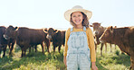 Happy child, farming and fun learning to care for animals, cows and cattle during nature travel in countryside. Portrait of girl kid smiling and happy enjoying rural beef farm life and sustainability