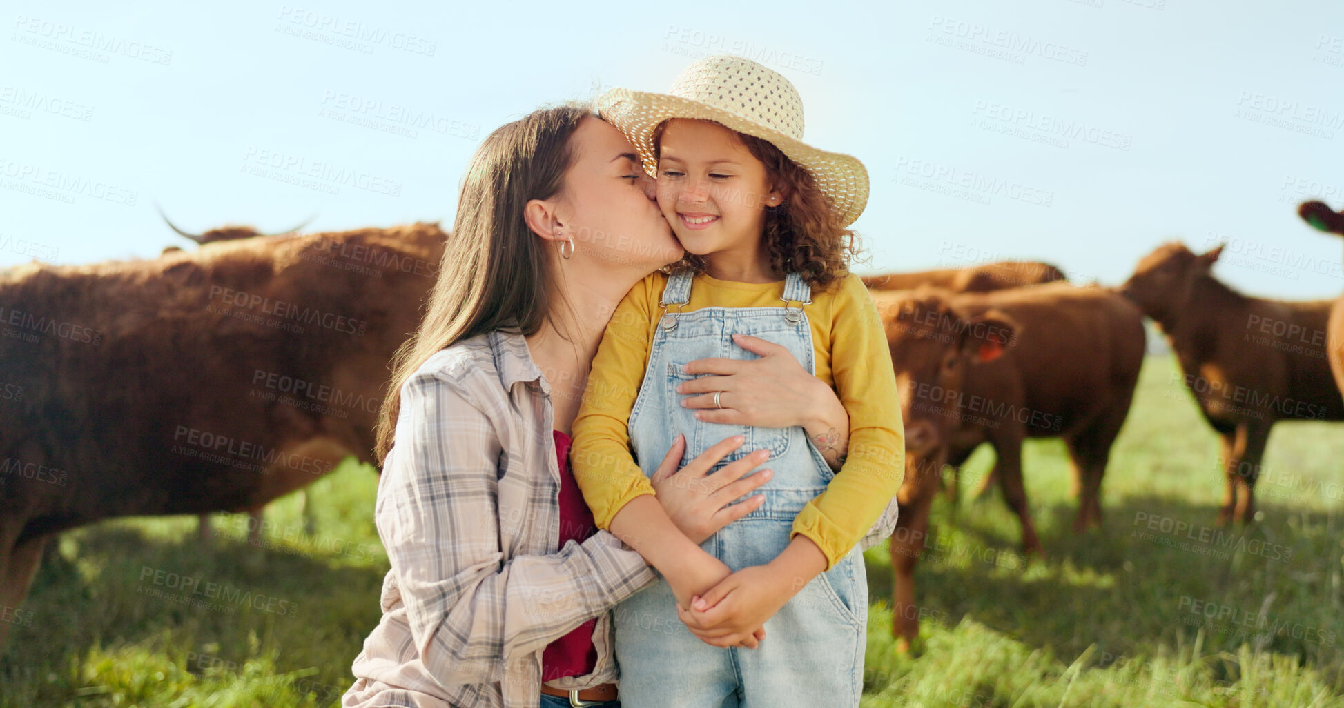 Buy stock photo Farm, family and a mother kissing her daughter with cattle for agriculture in a field for sustainability. Countryside, hug and a farmer woman with her girl child outdoor together for dairy farming