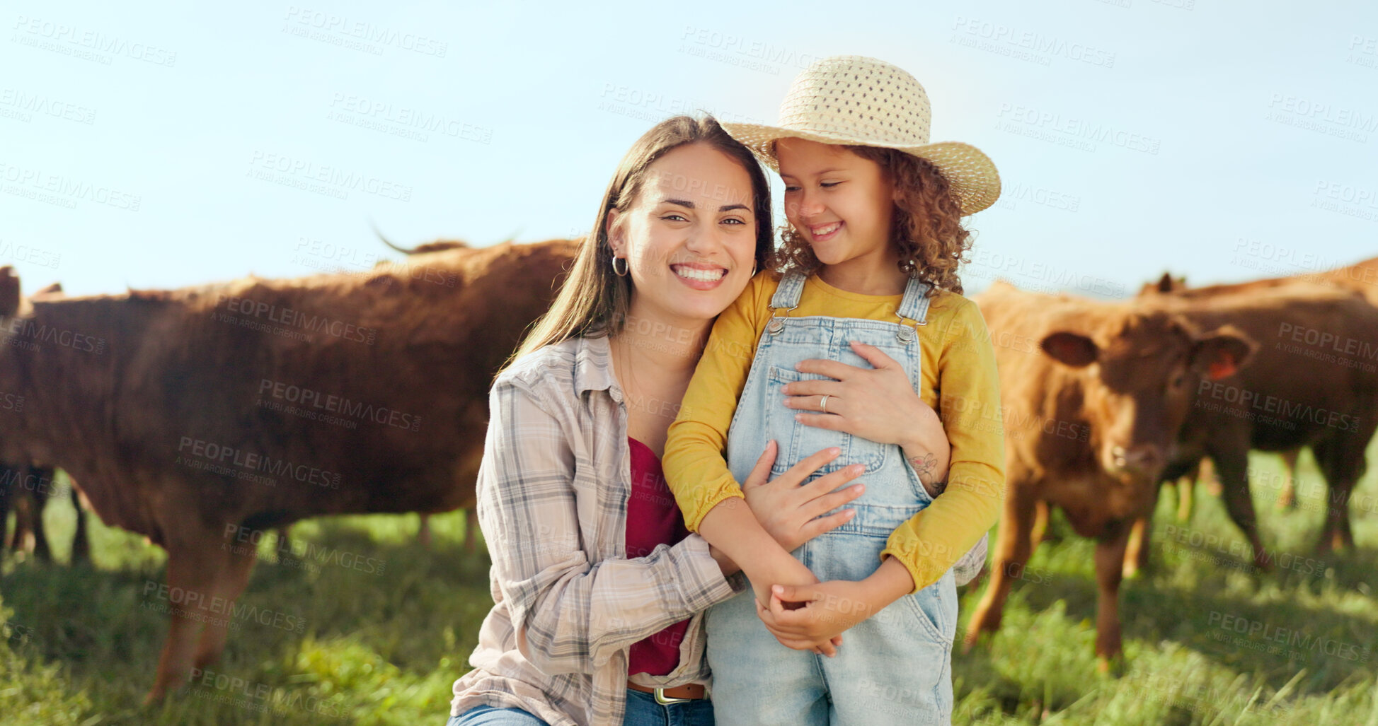 Buy stock photo Portrait, farm and a mother hugging her daughter with cattle for agriculture in a field for sustainability. Family, countryside and a farmer woman embracing her girl child outdoor for dairy farming