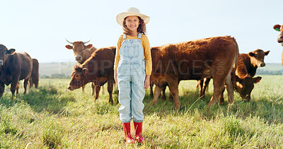 Happy, girl and farm, cow and sustainability in agriculture with a smile for growth, freedom and portrait. Countryside child, smile or kid in a field of grass, cattle and ecology livestock animals