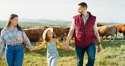 Farmer family, cow farm and field walk with girl and parents bonding in nature, enjoying conversation and relaxing. Agriculture, sustainable business and happy family having fun in the countryside