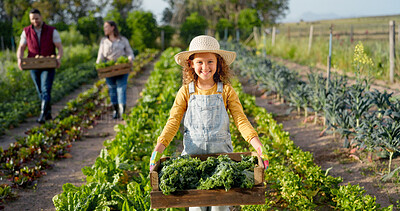 Little girl, farm and agriculture in green harvest for sustainability, organic and production in nature. Portrait of child holding crops in sustainable farming in the countryside for natural resource