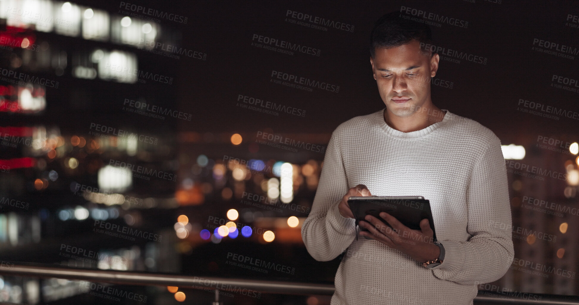 Buy stock photo Night, rooftop and professional man with tablet data, typing internet search and reading review, feedback or news. New York city, urban mock up and designer working late on social network advertising