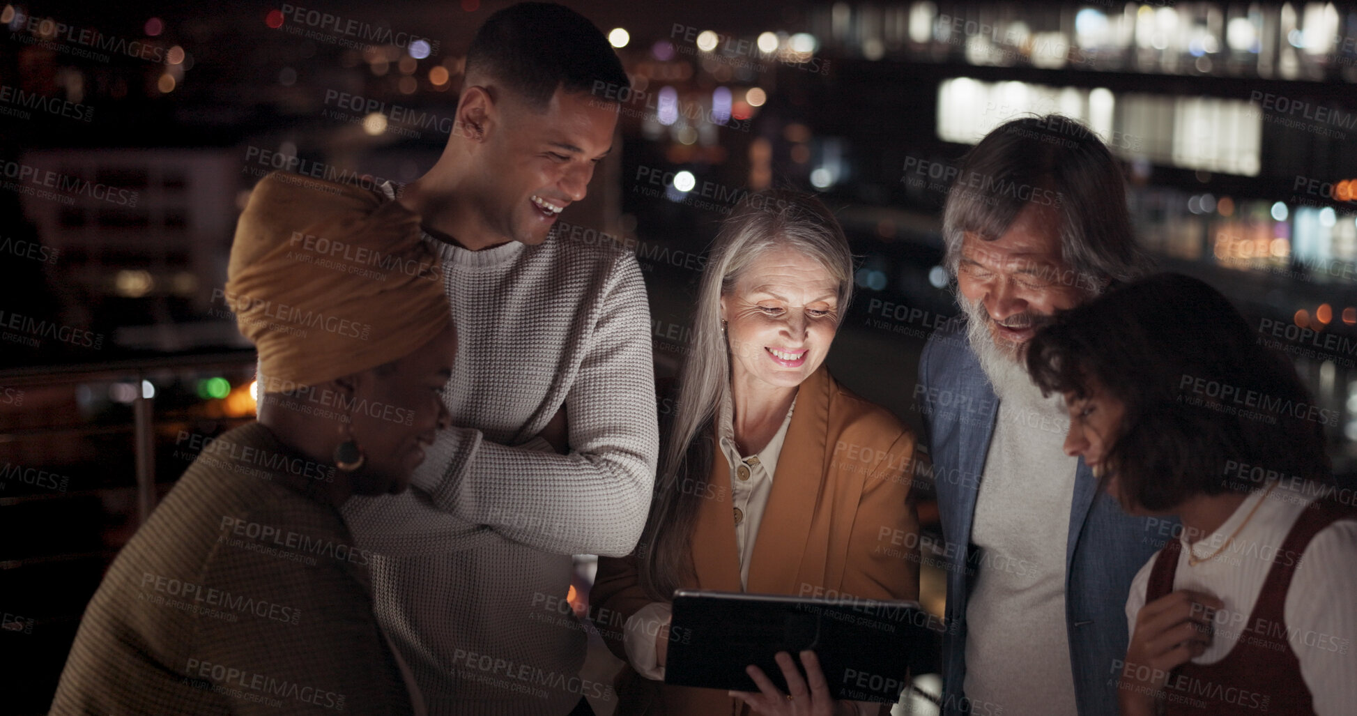 Buy stock photo Tablet, night and a business team on the balcony of their office together for collaboration or planning. Technology, teamwork and overtime training with an employee group in the city for late work