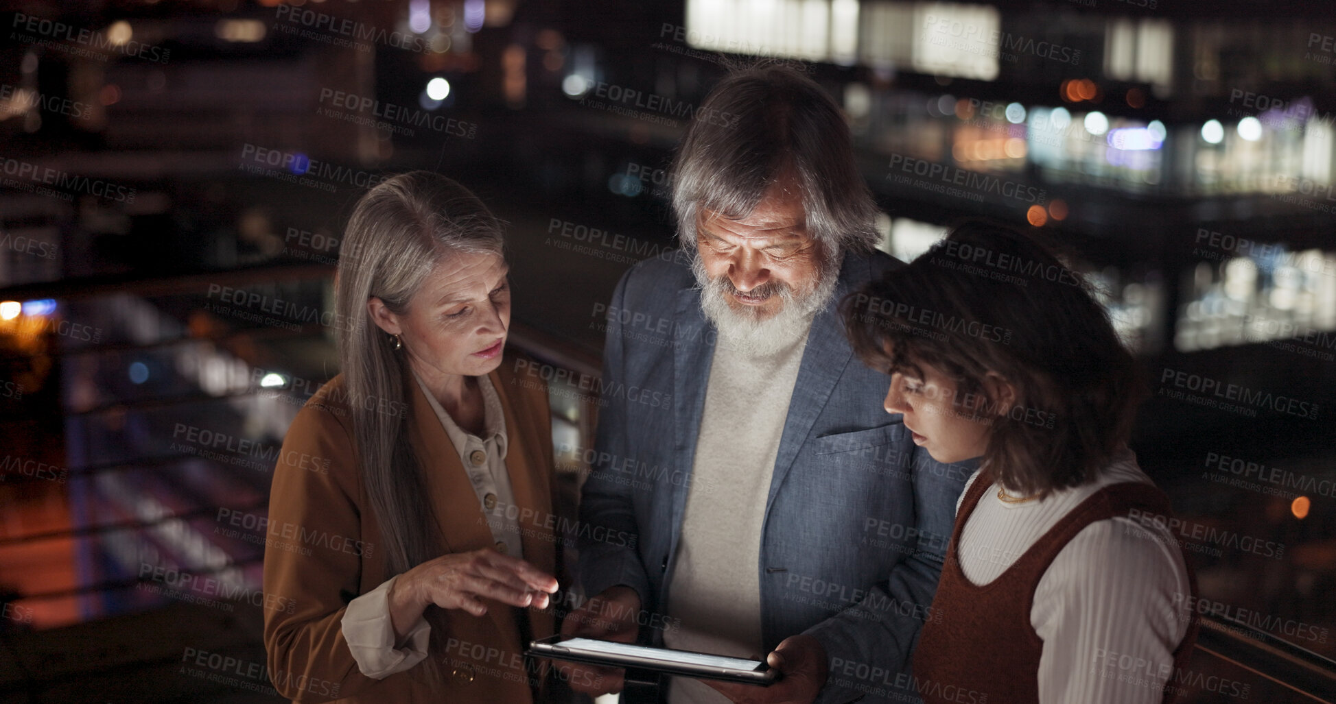 Buy stock photo Tablet, night and a management team on the balcony of their office together for collaboration or planning. Technology, teamwork and overtime training with a trading group in the city for late work