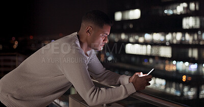Business man, phone and night data while online on an urban building rooftop typing email, search or communication for networking on trading app. Entrepreneur on terrace in dark with 5g network