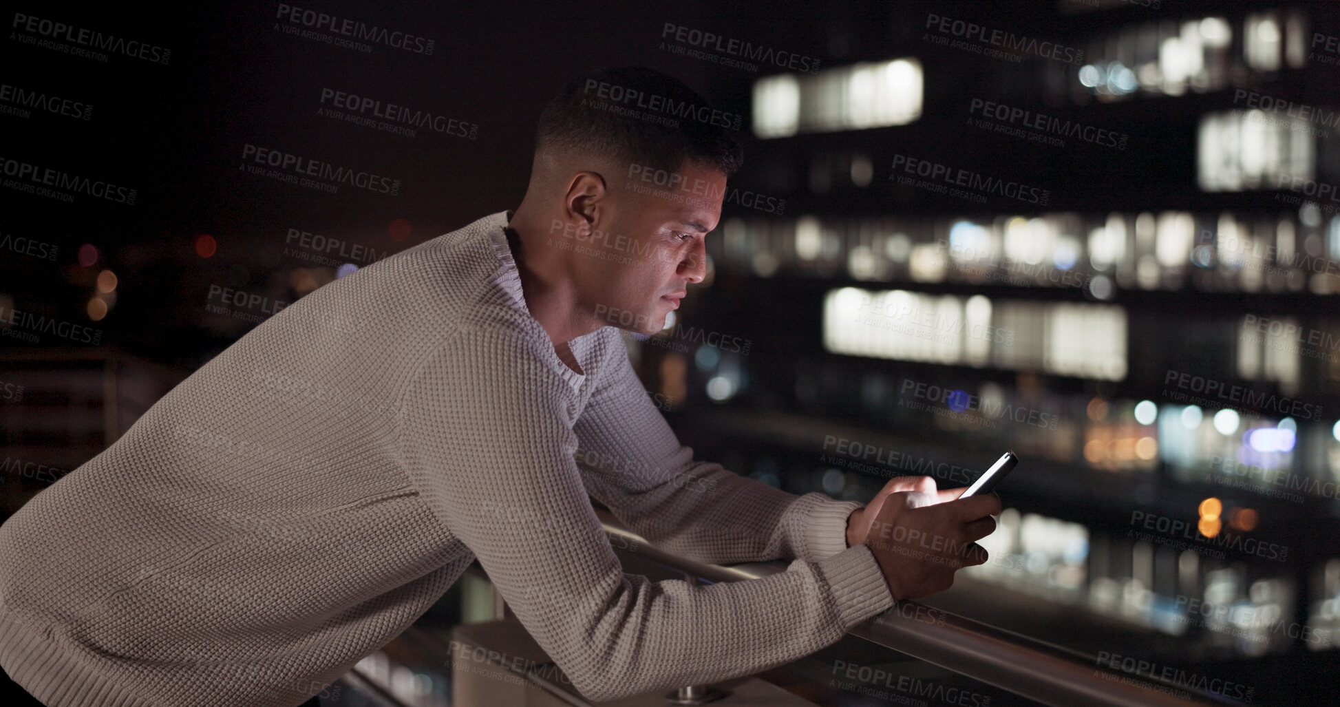 Buy stock photo Phone, night and business man on rooftop in city, reading email or network on social media. Smartphone, balcony and serious professional outdoor on internet, creative and communication on mobile app