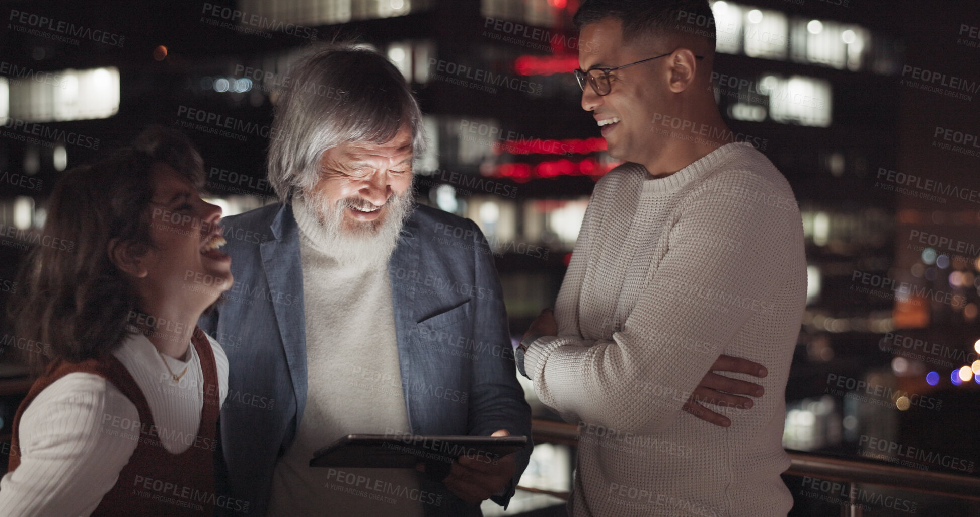 Buy stock photo Tablet, night and happy with business people in city on rooftop office together for collaboration or planning. Technology, teamwork and training with a funny employee group laughing for late work