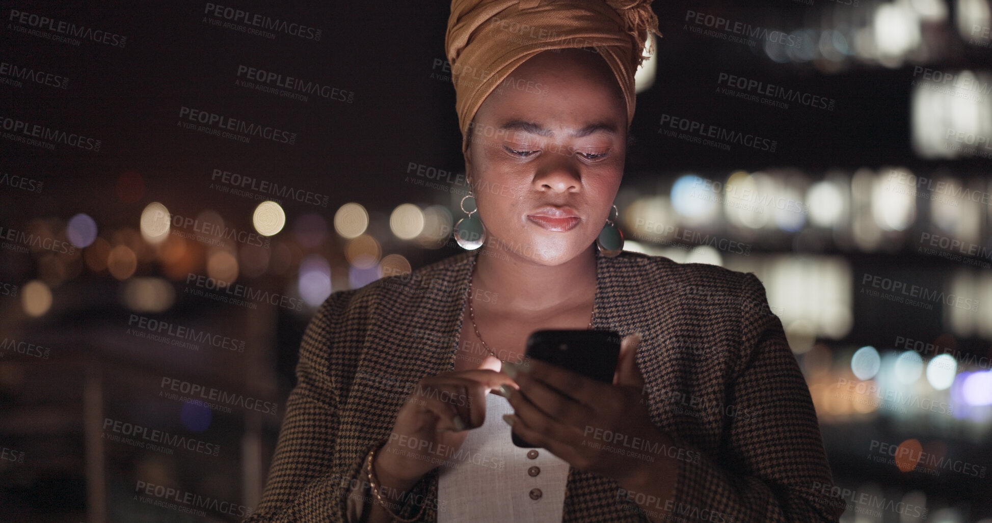 Buy stock photo Phone, night and black woman in city for business, reading deadline email or network on social media bokeh. Smartphone, creative and serious professional outdoor on internet, typing or communication