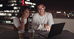 Laptop, collaboration and night with a business team working together on balcony in the city. Teamwork, computer and overtime with a man and woman employee at work late on a project deadline