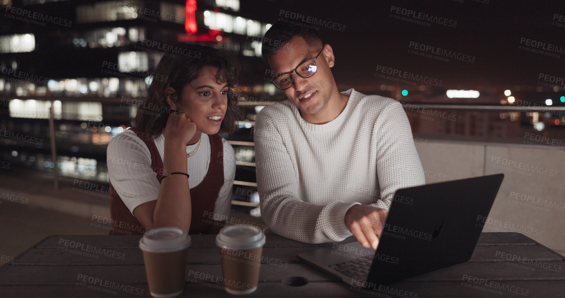 Buy stock photo Night teamwork, laptop and business people reading website, research or gesture at online design on city rooftop. Media analyst analysis of web traffic, social network or search engine advertising