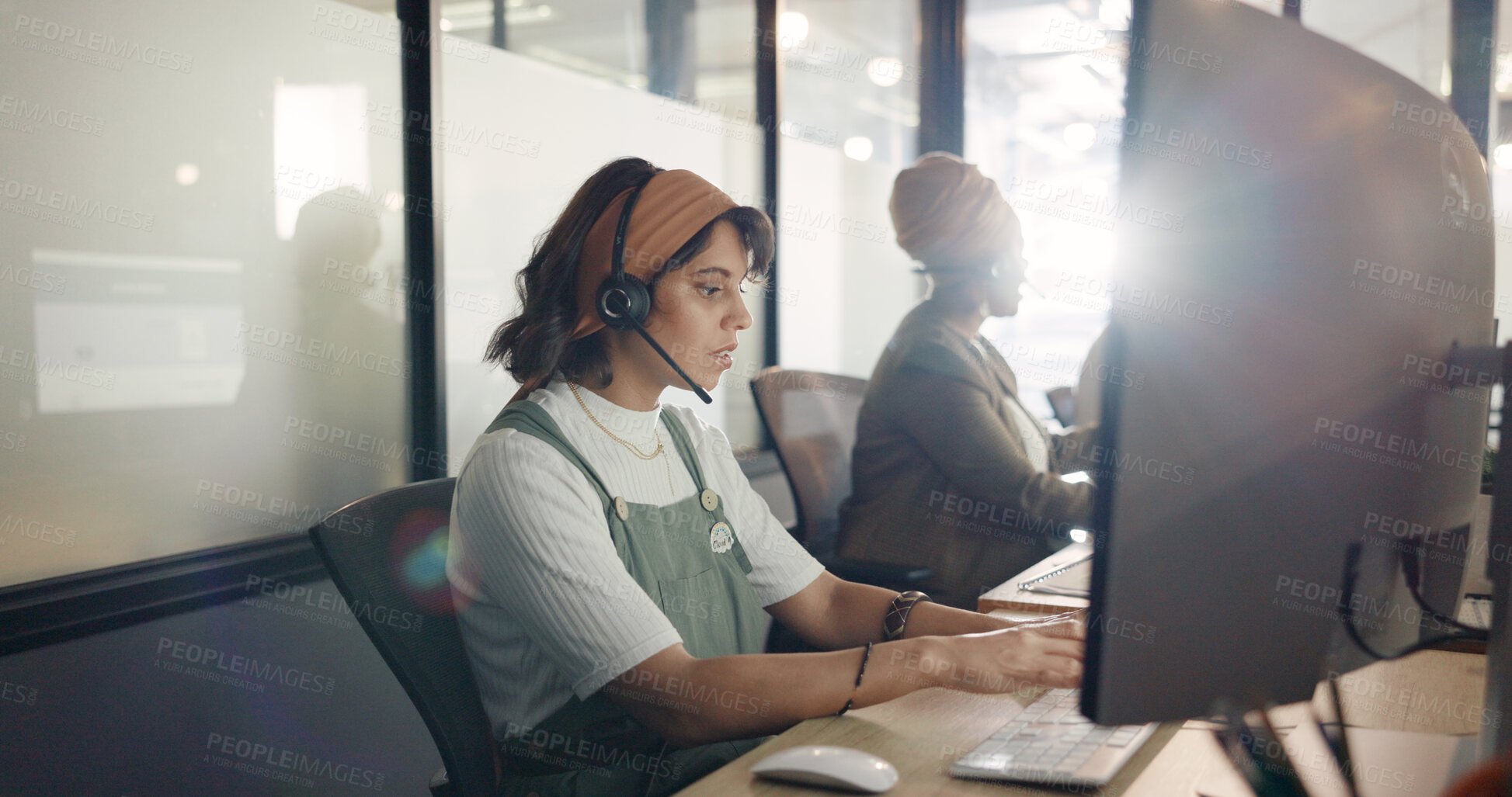 Buy stock photo Call center, staff and computer with woman, connection and lens flare with sales agent, crm and customer service. Person, telemarketing or consultant with tech support, employee and help desk with pc