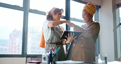 Buy stock photo Tablet, teamwork and a fist bump with business people in the office for support, success or motivation. Collaboration, smile and celebration of a goal or target with employee women in the workplace