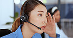 Stress, call center and Asian woman frustrated with client talking,discussion and conversation online. Customer service, telemarketing and female consultant with headache with difficult customer call