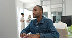 Office computer, thinking and black man reading feedback review of social network, customer experience or ecommerce. Website analytics, research report and media employee doing online survey analysis