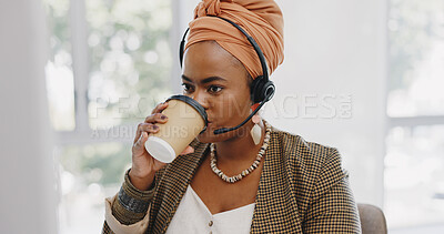Call center, customer service and black woman consultant in the office consulting online while drinking coffee. Customer support, telemarketing and professional African female crm expert in workplace