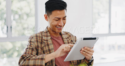Tablet, research and creative with an asian man designer thinking about an idea while working on a design. Internet, innovation and search with a male employee at work in his marketing office