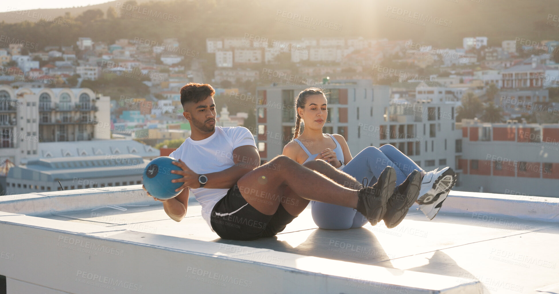 Buy stock photo Health, medicine ball and fitness with couple in city for training, sports and support. Wellness, workout and exercise with man and woman on rooftop for challenge, teamwork and motivation together