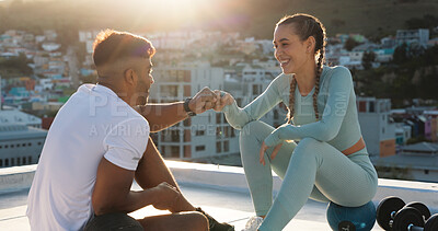 Fitness, couple and fist bump for sports exercise, workout or training together in the city outdoors. Happy woman and man in social conversation, communication or talking after cardio exercising and fist pump