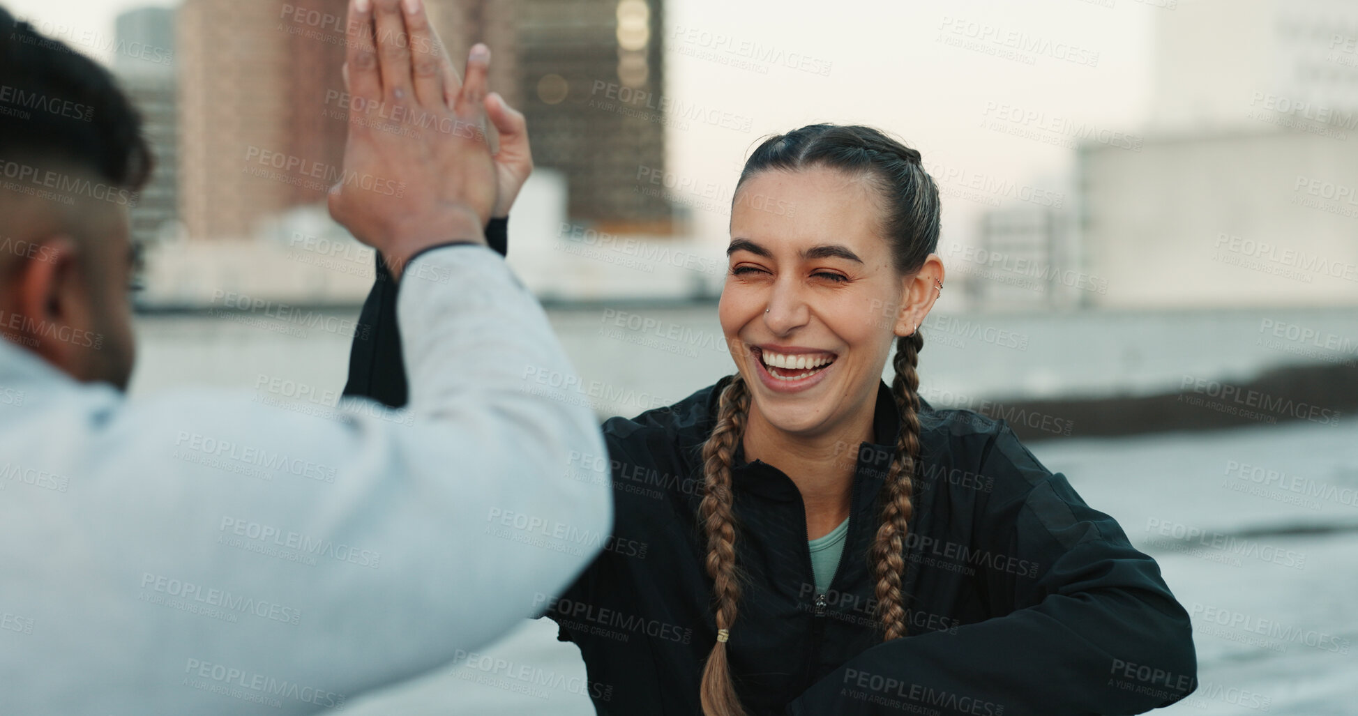 Buy stock photo Happy couple, celebration or high five on rooftop for fitness exercise or workout together with pride or smile. Athletes, motivation or excited or man with woman, support or goal on building in city