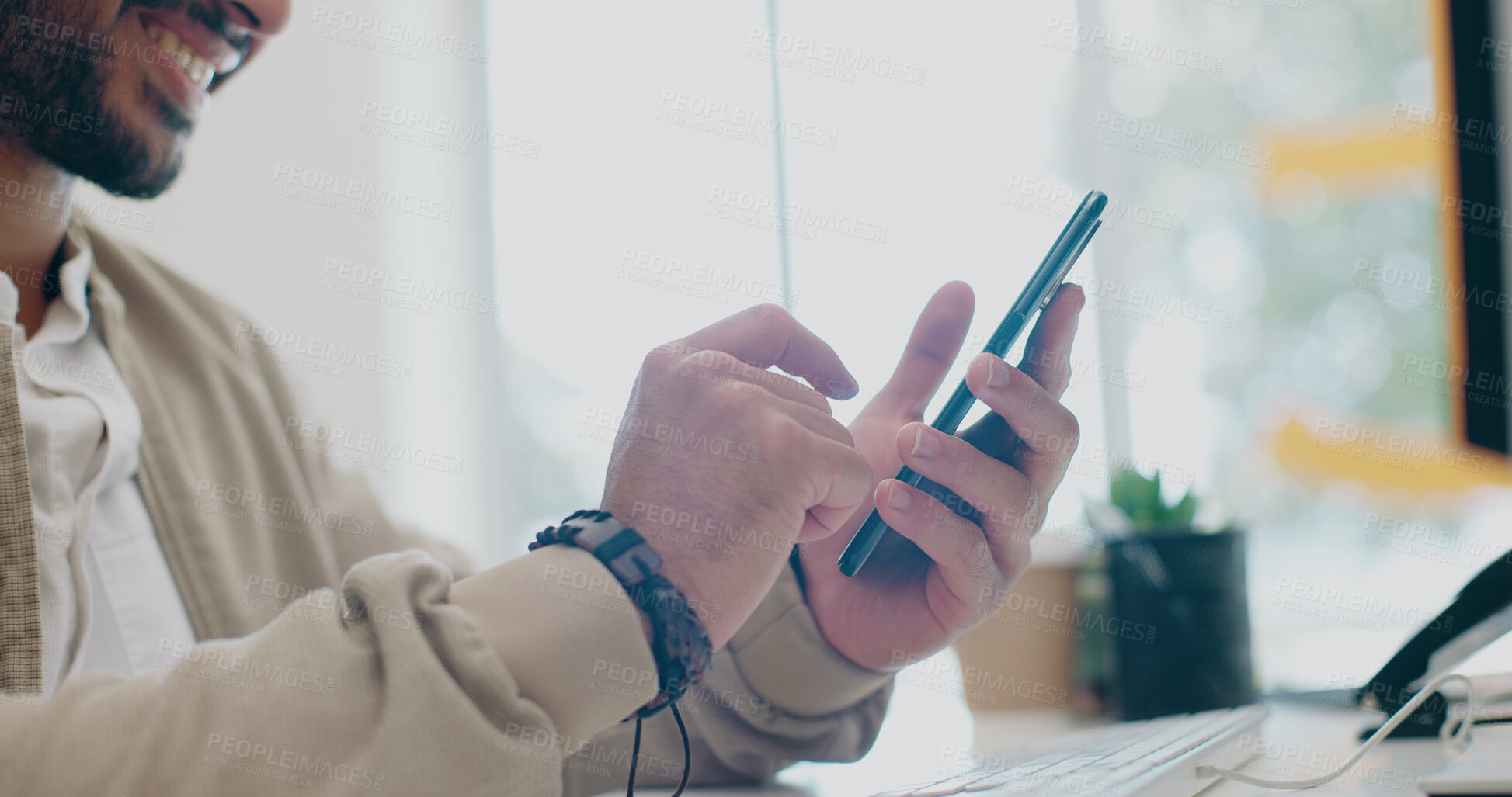 Buy stock photo Hands of happy man, phone in office and typing on social media, email or post for business networking. Scroll, good news and businessman with mobile app on smartphone, chat online and smile at desk.