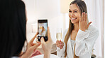 Wedding, ring and engagement with a woman or bride taking a photograph on a phone and drinking champagne with a friend. Happy, smile and celebration with an attractive young female and her bridesmaid